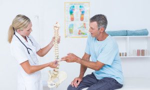 Doctor and patient discussing spinal cord